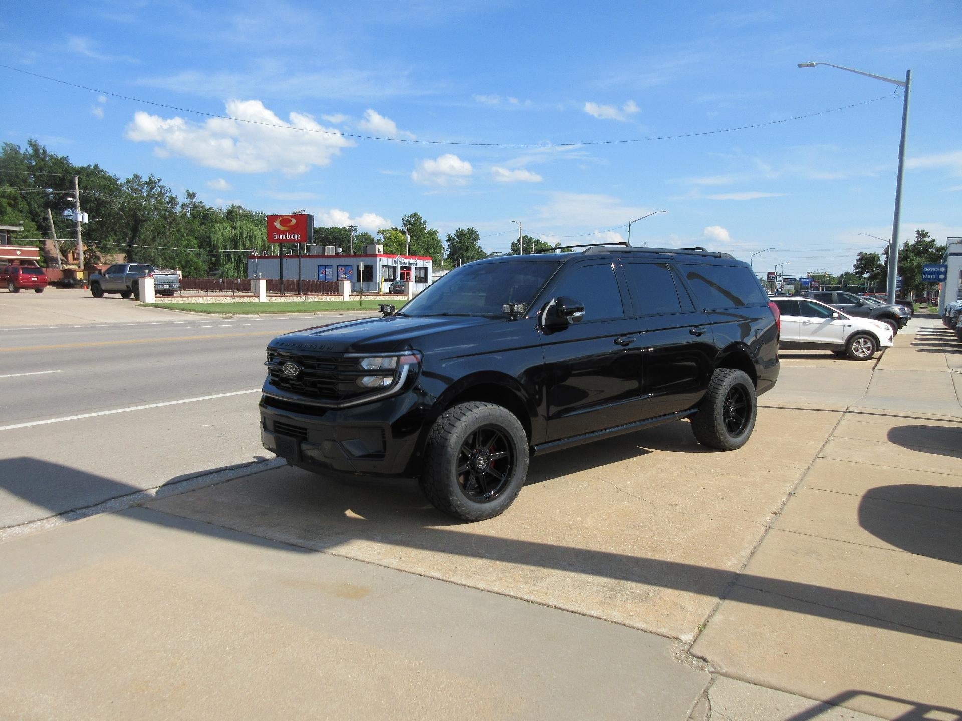 2025 Ford Expedition Max Platinum 4x4 in Agate Black Metallic — front three-quarter view