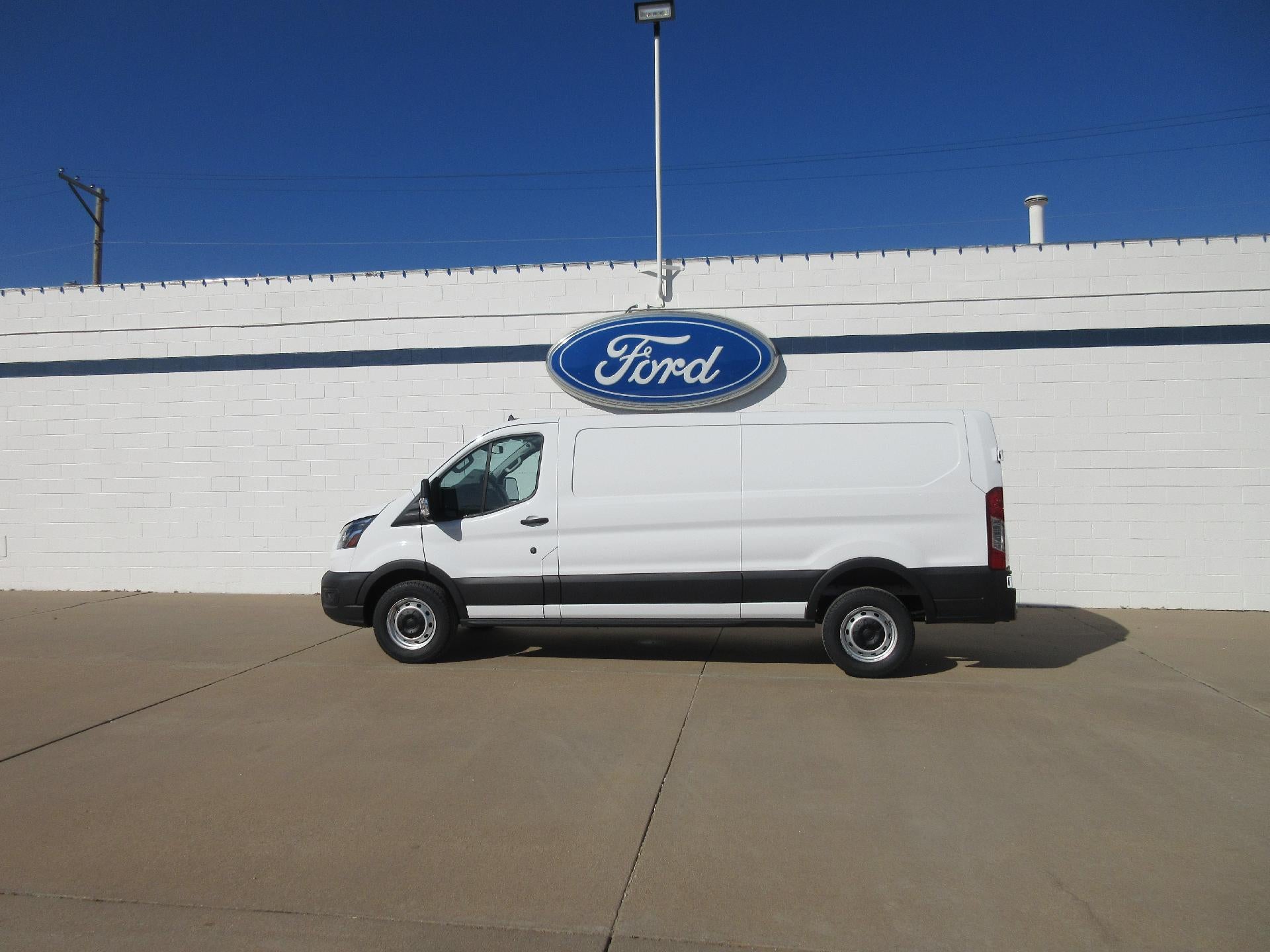 2025 Ford Transit Cargo Van T-250 148" Low Rf 9070 GVWR RWD in Oxford White — front three-quarter view