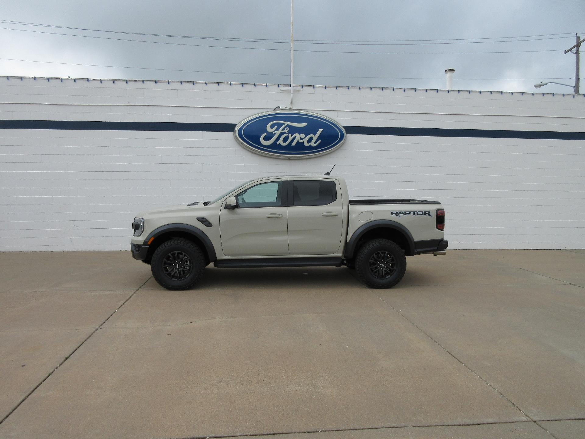 2025 Ford Ranger Raptor 4WD SuperCrew 5' Box in Desert Sand — front three-quarter view