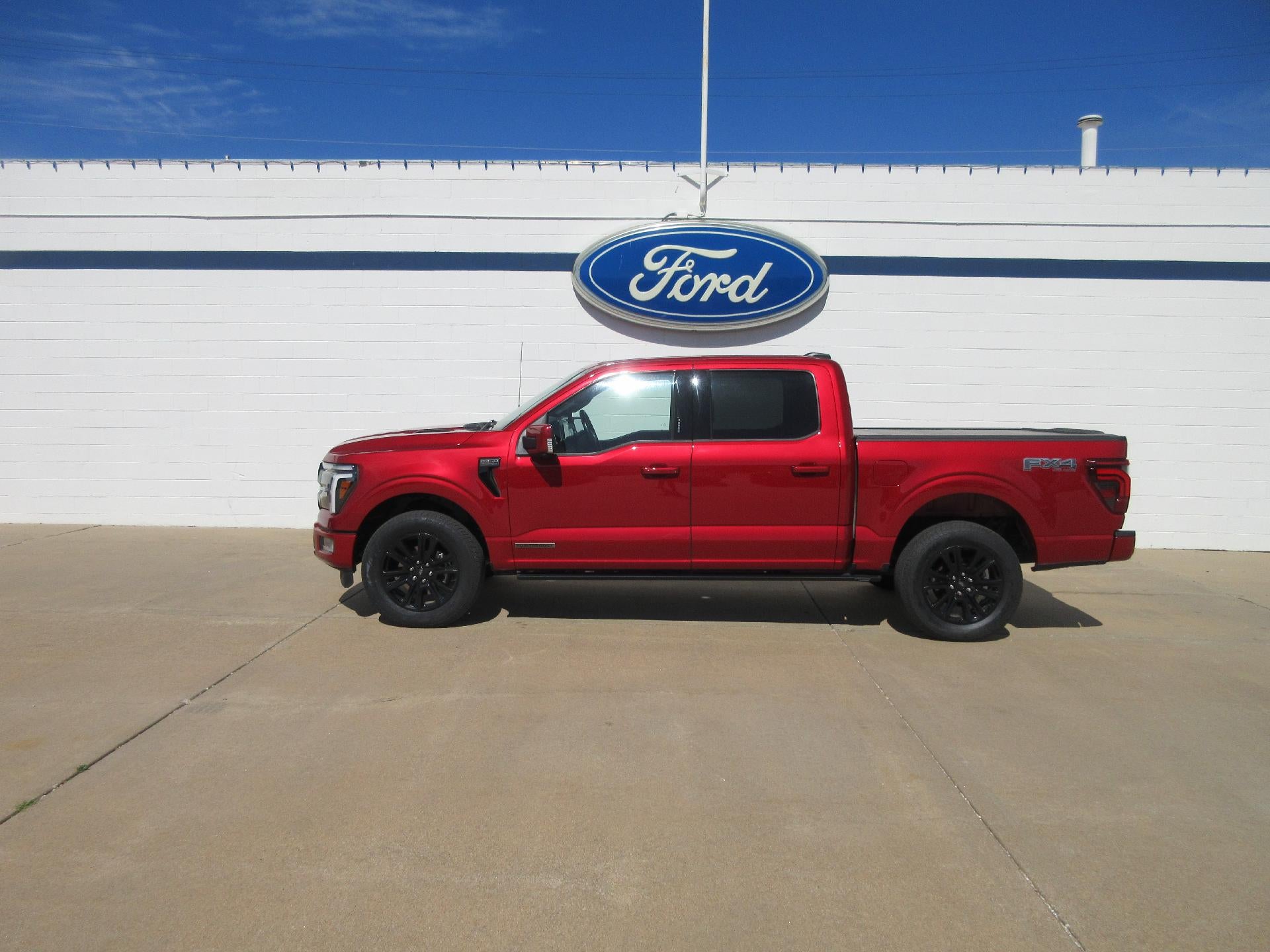 2024 Ford F-150 Platinum 4WD SuperCrew 5.5' Box in Rapid Red Metallic Tinted Clearcoat — front three-quarter view