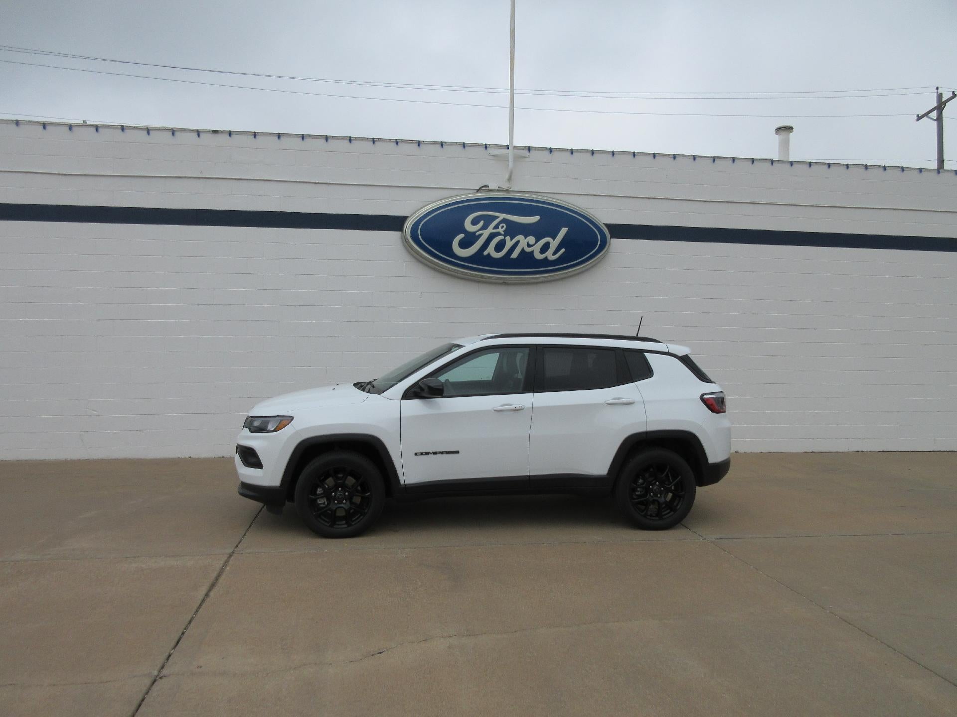 2025 Jeep Compass Latitude 4x4 in Bright White Clearcoat — front three-quarter view