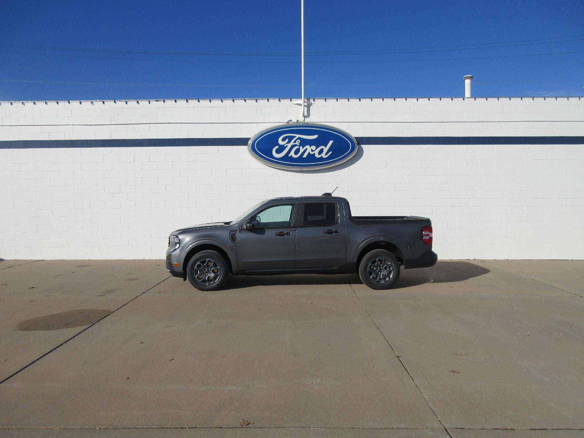 2026 Ford Maverick XLT AWD SuperCrew in Carbonized Gray Metallic — front three-quarter view